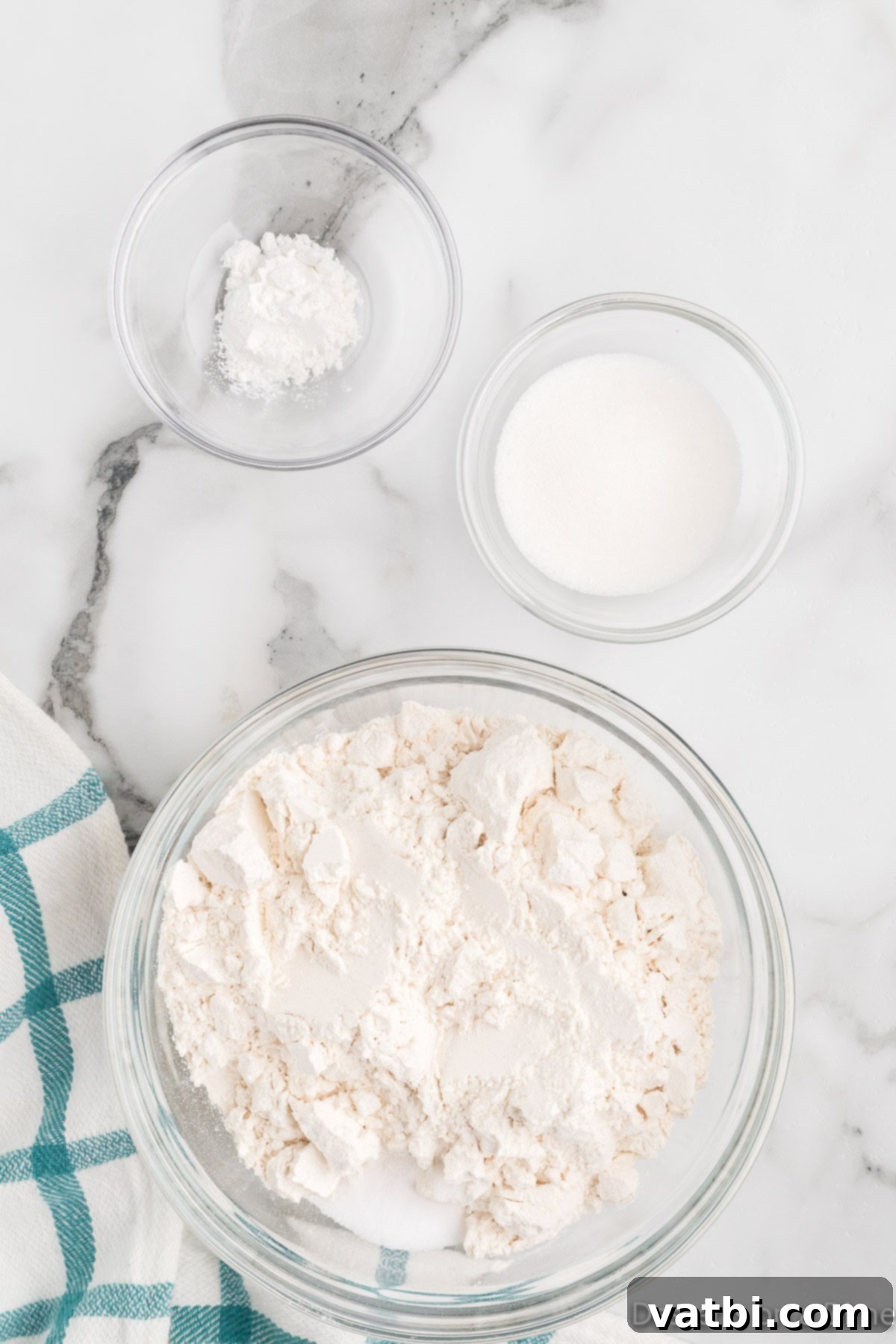 Sweet Funnel Cake Perfection 4 Dry ingredients for funnel cake batter in a mixing bowl.