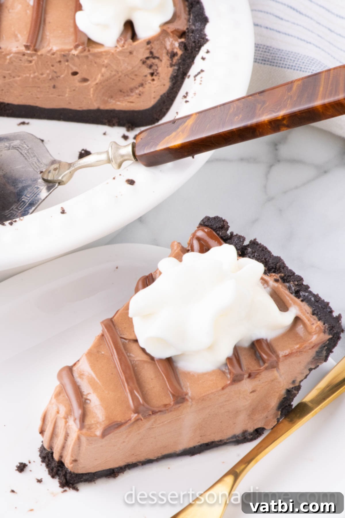 Decadent No Bake Nutella Cheesecake 2 No bake nutella cheesecake sliced on plate.