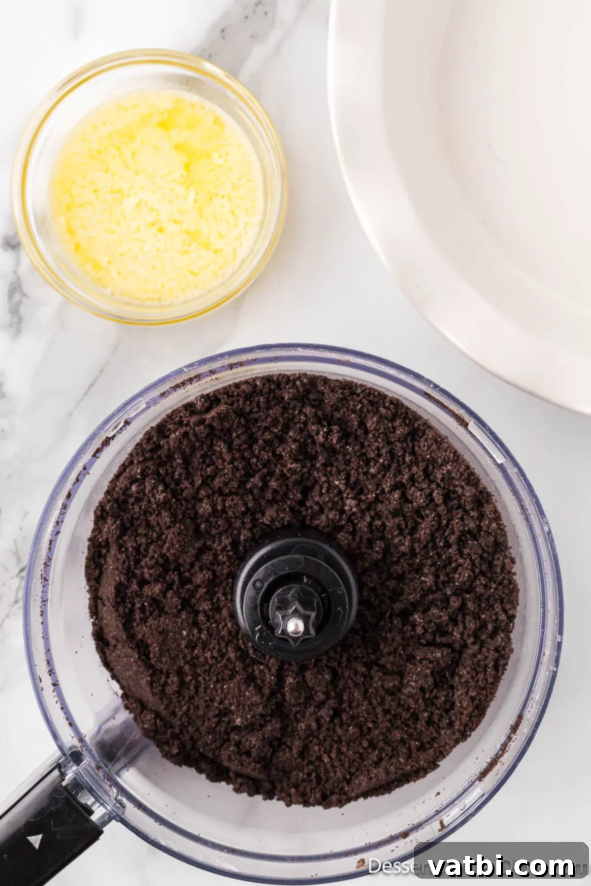 Decadent No Bake Nutella Cheesecake 4 Cookie crumbs in food processor.