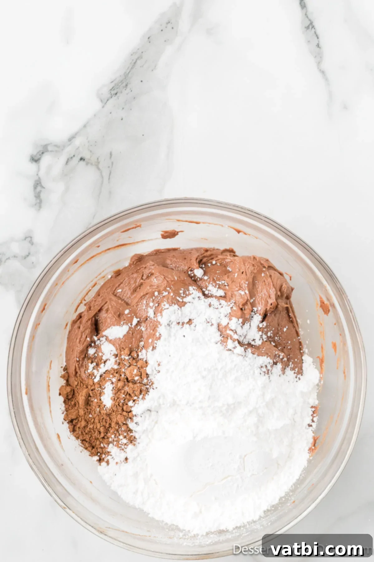 Decadent No Bake Nutella Cheesecake 8 Cocoa powder and powdered sugar combined into Nutella mixture.