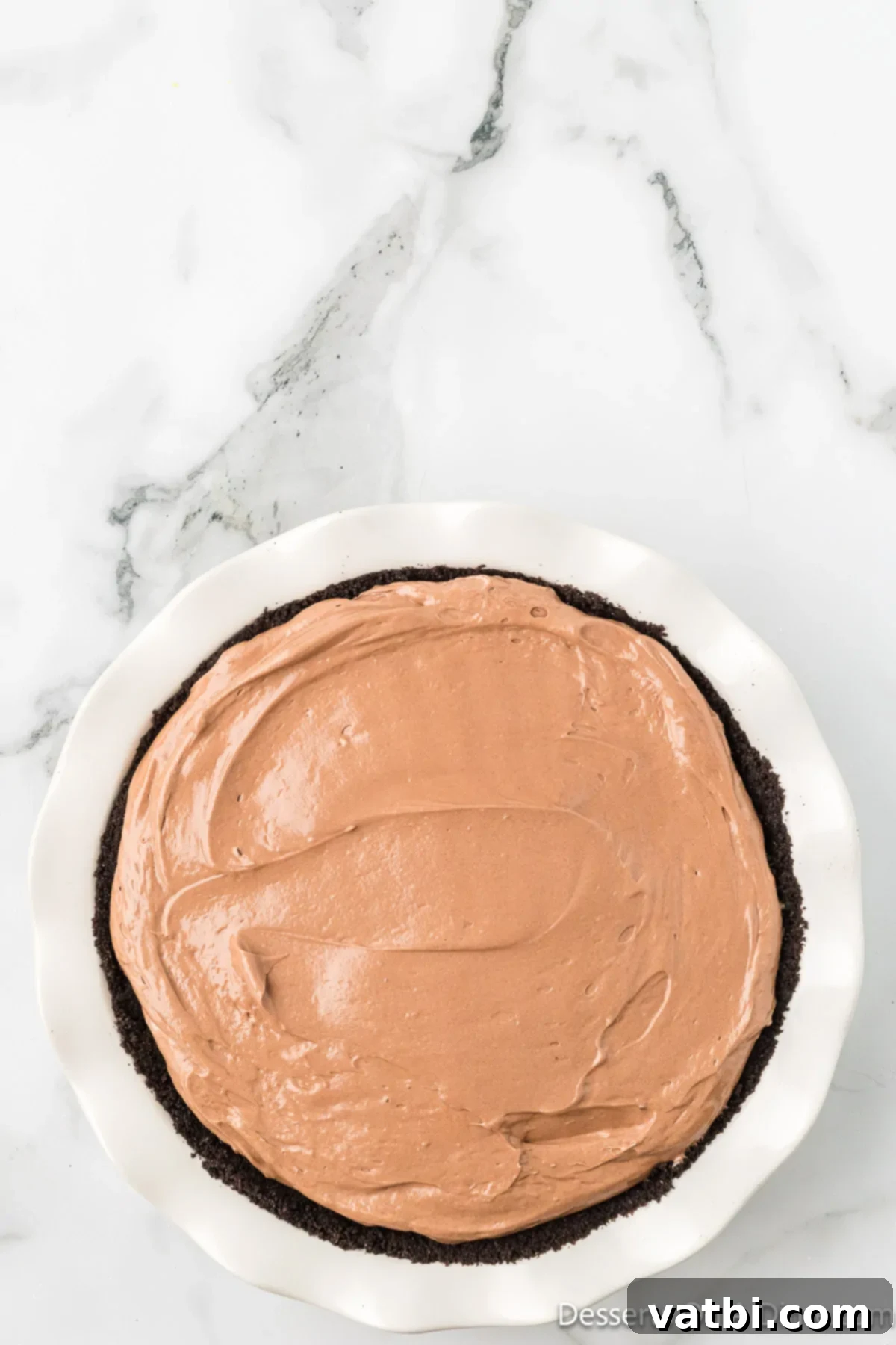 Decadent No Bake Nutella Cheesecake 10 Nutella mixture smoothed over pie crust.