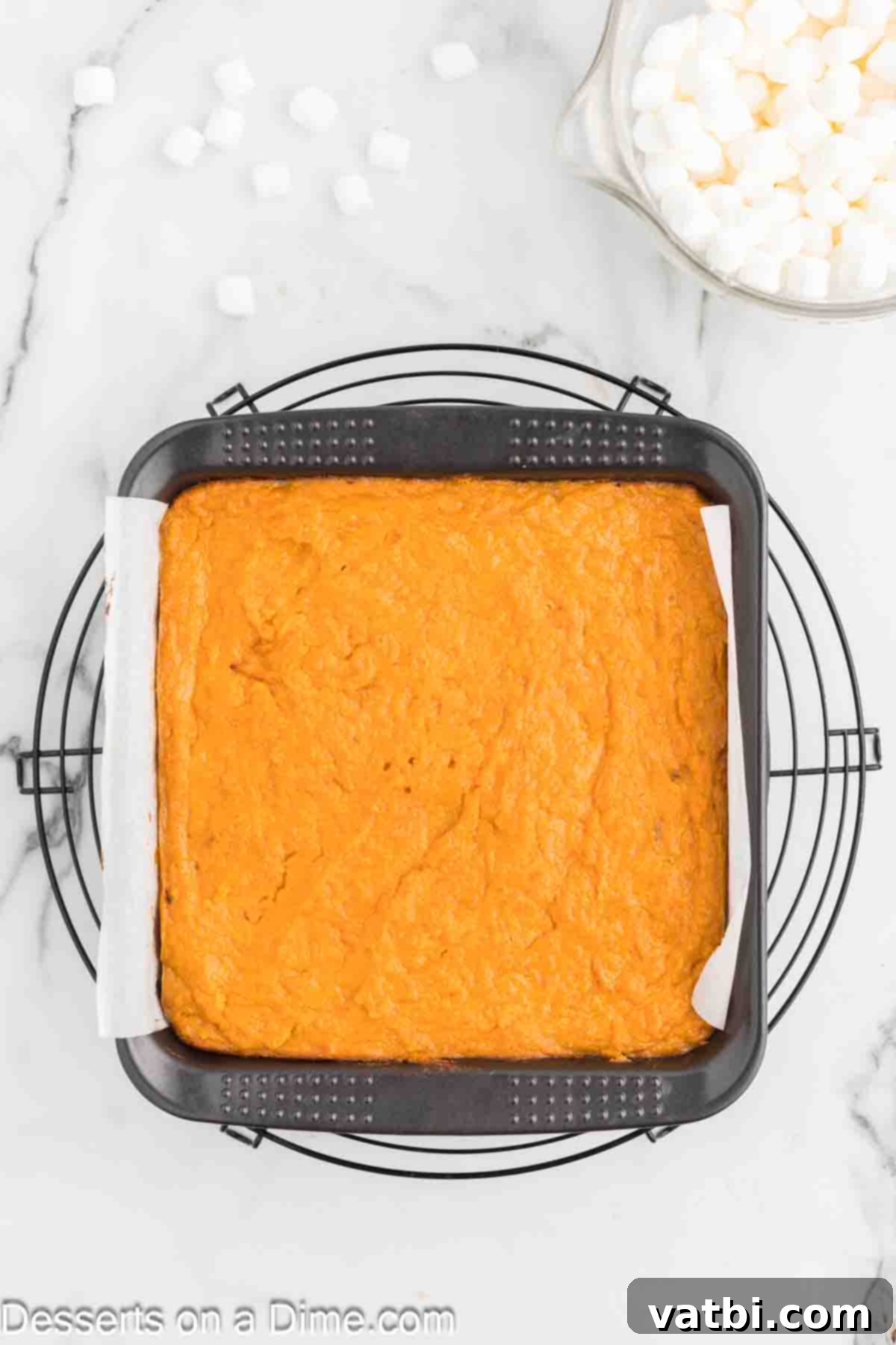 Sweet potato filling poured smoothly over the baked graham cracker crust in the baking dish.