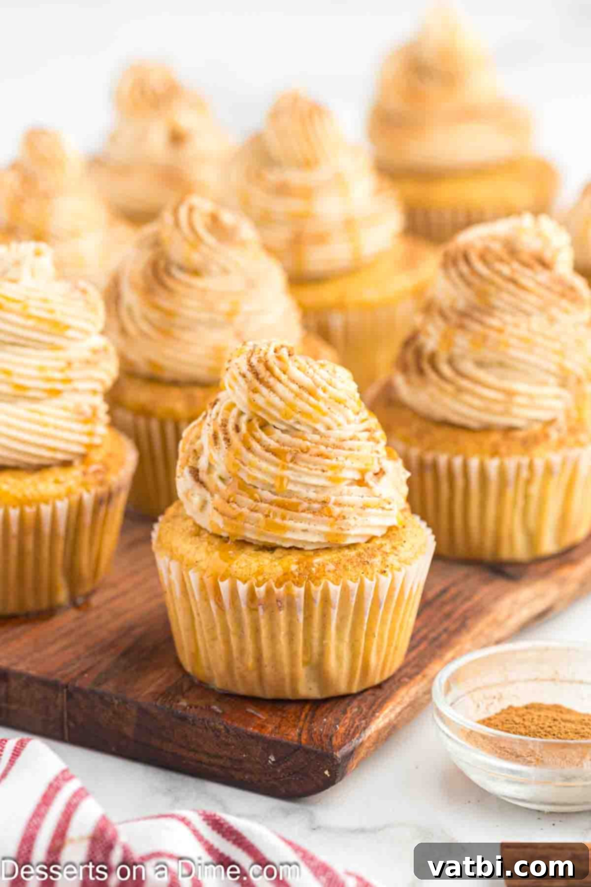 Apple Crumble Cupcakes 2 Beautifully decorated apple pie cupcakes, ready to be served and enjoyed as a delicious fall dessert.