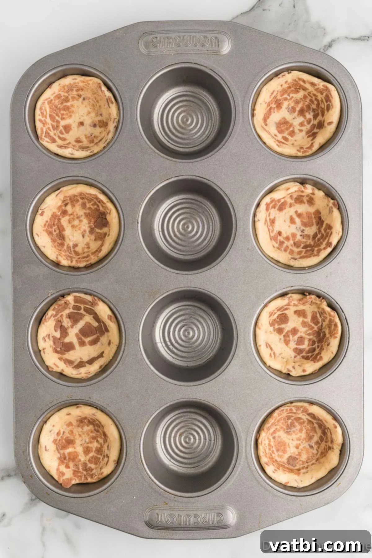 Cinnamon Roll Apple Pie Cups 5 Cinnamon rolls in muffin tin.