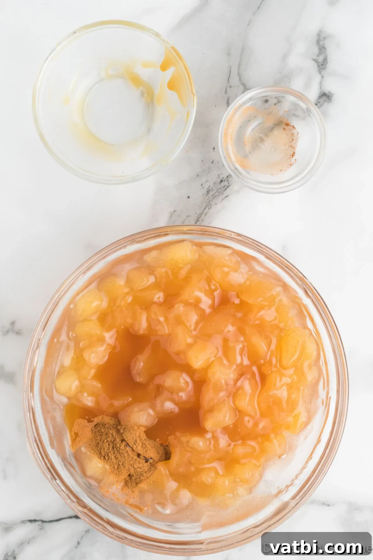 Cinnamon Roll Apple Pie Cups 7 Caramel sauce added to bowl.