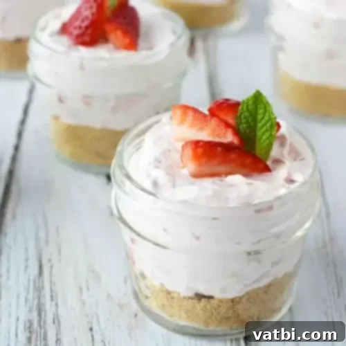 No-Bake Strawberry Cheesecake in a Jar with layers visible.