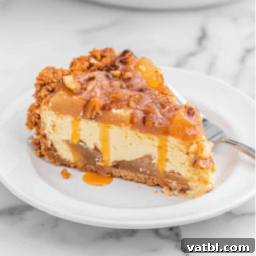 Caramel Apple Cheesecake slice with caramel drizzle.