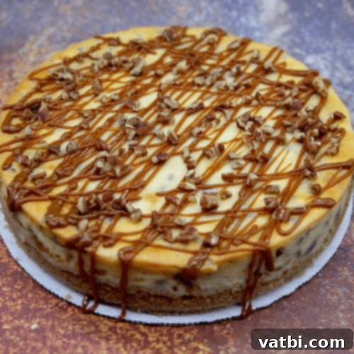 Browned Butter Pecan Cheesecake with a creamy topping.