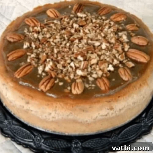 Pecan Praline Cheesecake slice with a generous praline topping.