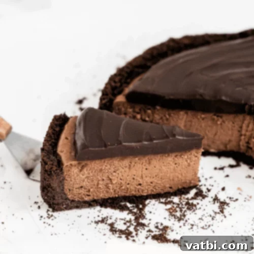 Death by Chocolate Cheesecake slice with chocolate ganache.