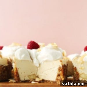 White Chocolate Macadamia Nut Cheesecake topped with nuts.