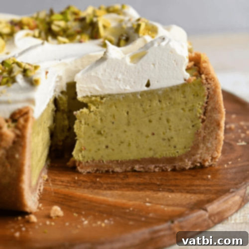 Pistachio Cheesecake slice with chopped pistachios.