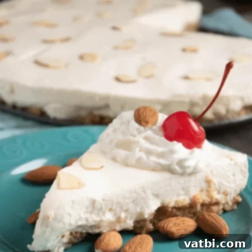 No Bake Almond Cheesecake slice with almond slivers.