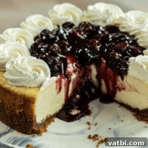 Cherry Almond Cheesecake slice with cherry topping.