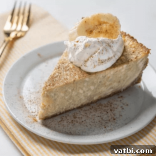 Banana Cheesecake slice with whipped cream and banana.