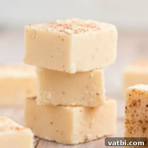 55 Festive & Easy Christmas Fudge Ideas 4 Creamy squares of Eggnog Fudge, perfect for holiday indulgence.