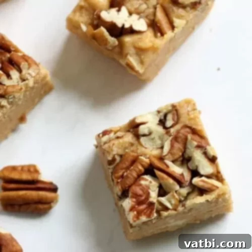 55 Festive & Easy Christmas Fudge Ideas 20 Pumpkin Fudge squares, garnished with a sprinkle of spice.