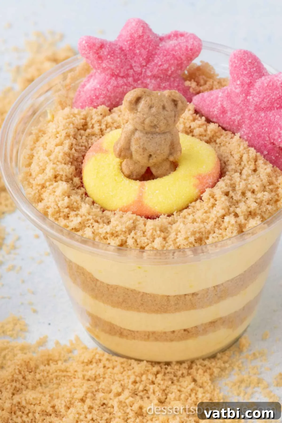 No-Bake Beach Pudding Cups 2 Sand Pudding Cups ready to enjoy, decorated with gummy candies and Teddy Grahams.