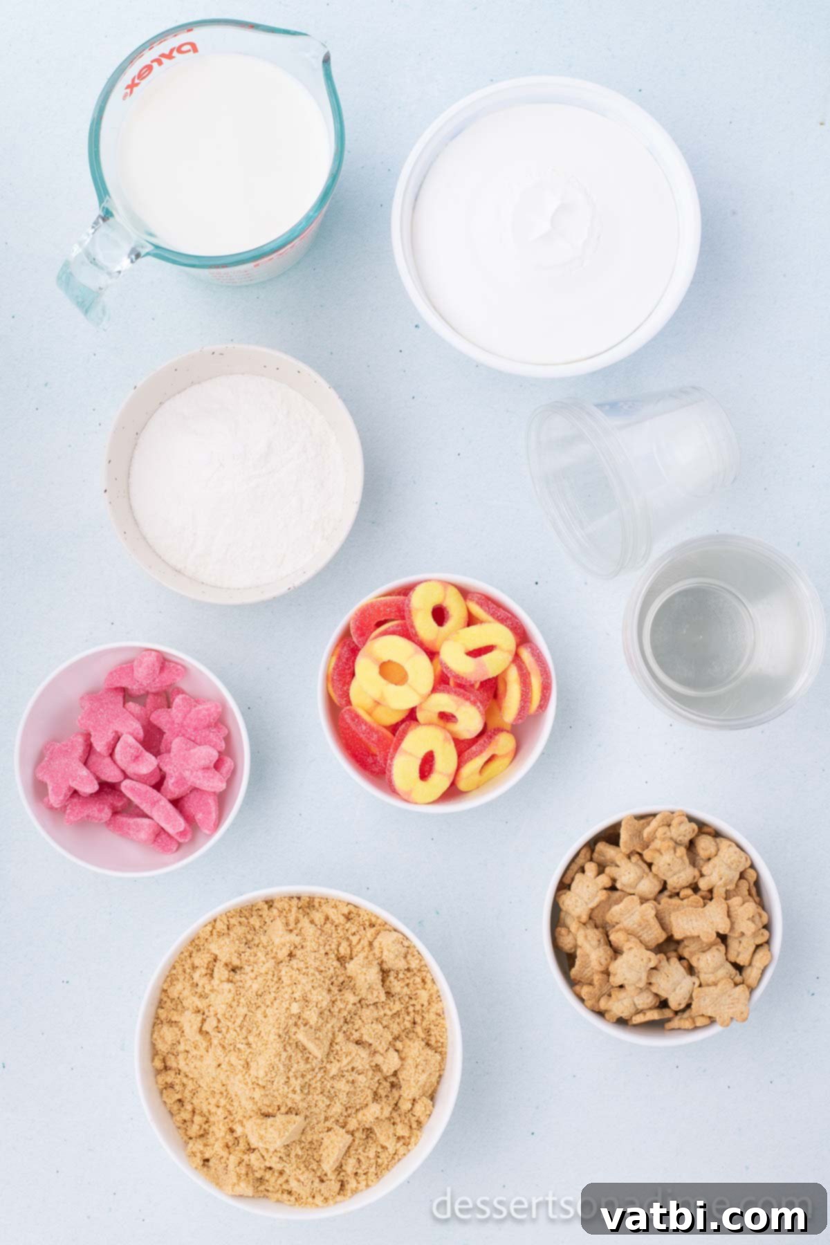 No-Bake Beach Pudding Cups 3 Ingredients for Sand Pudding Cups recipe - instant pudding, whipped topping, Golden Oreo cookies, and various gummy candies.
