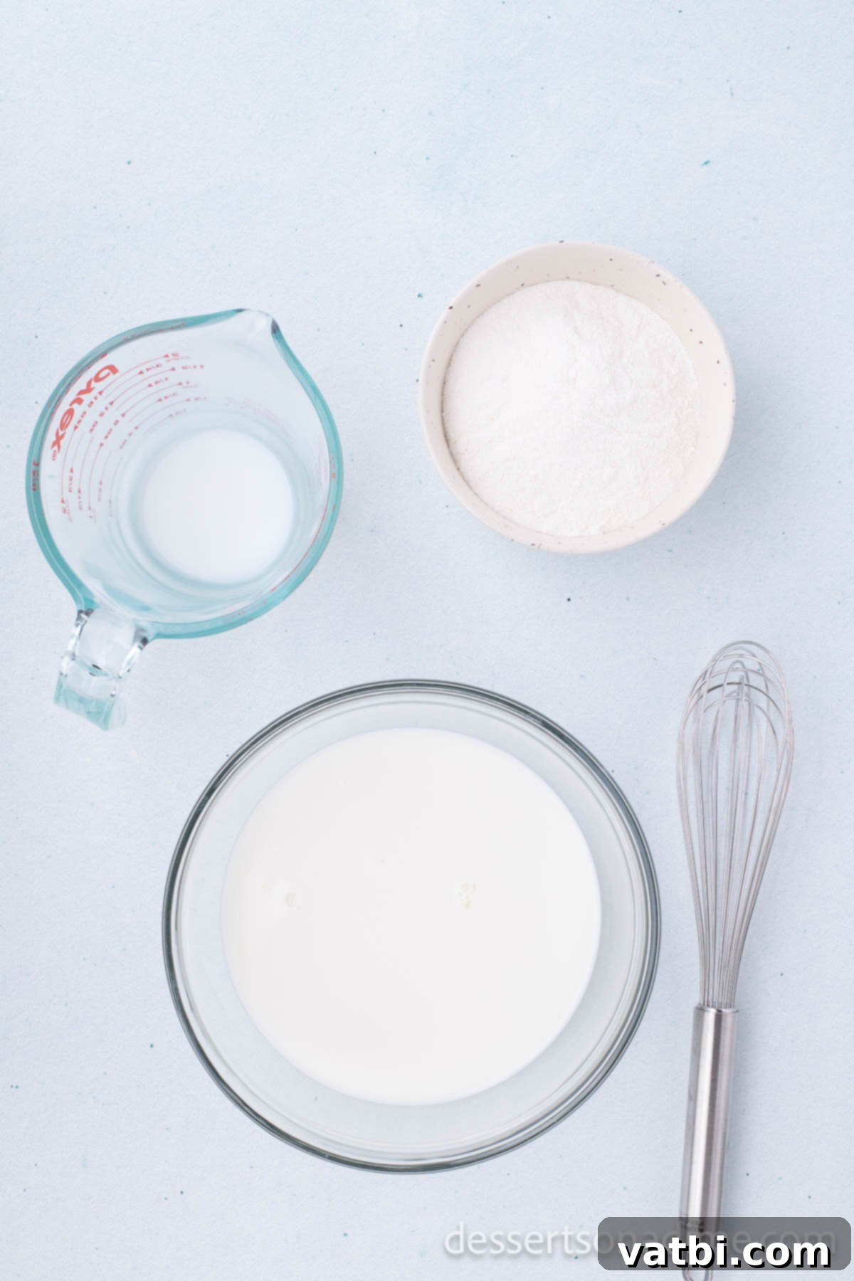 No-Bake Beach Pudding Cups 4 Pudding mix and milk being combined in a bowl with a whisk.