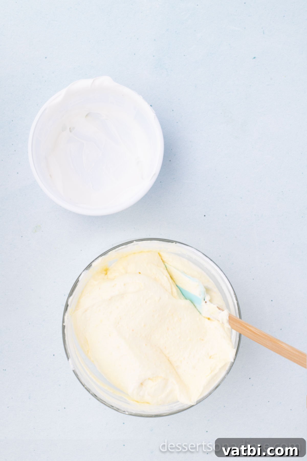 No-Bake Beach Pudding Cups 6 Cool Whip or whipped topping being gently folded into the pudding mixture.