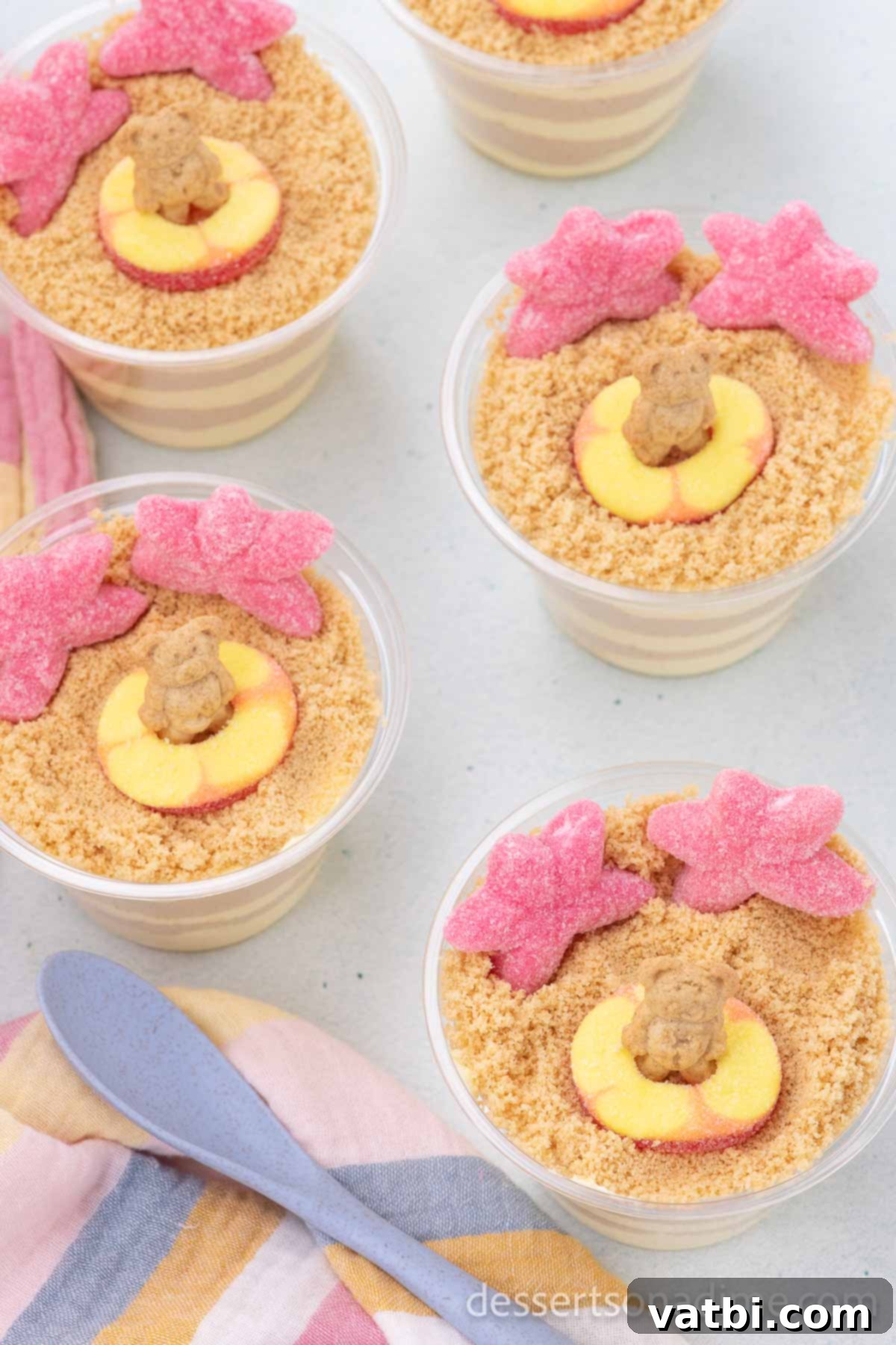 No-Bake Beach Pudding Cups 9 Sand pudding cups with various beach-themed candy toppings.