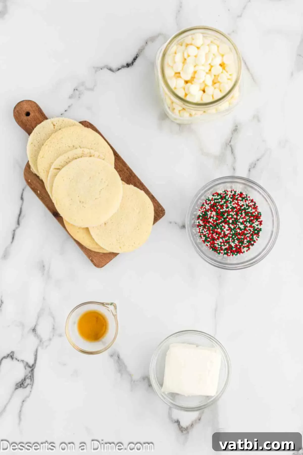 sugar cookies, cream cheese, vanilla, white chocolate chips, sprinkles