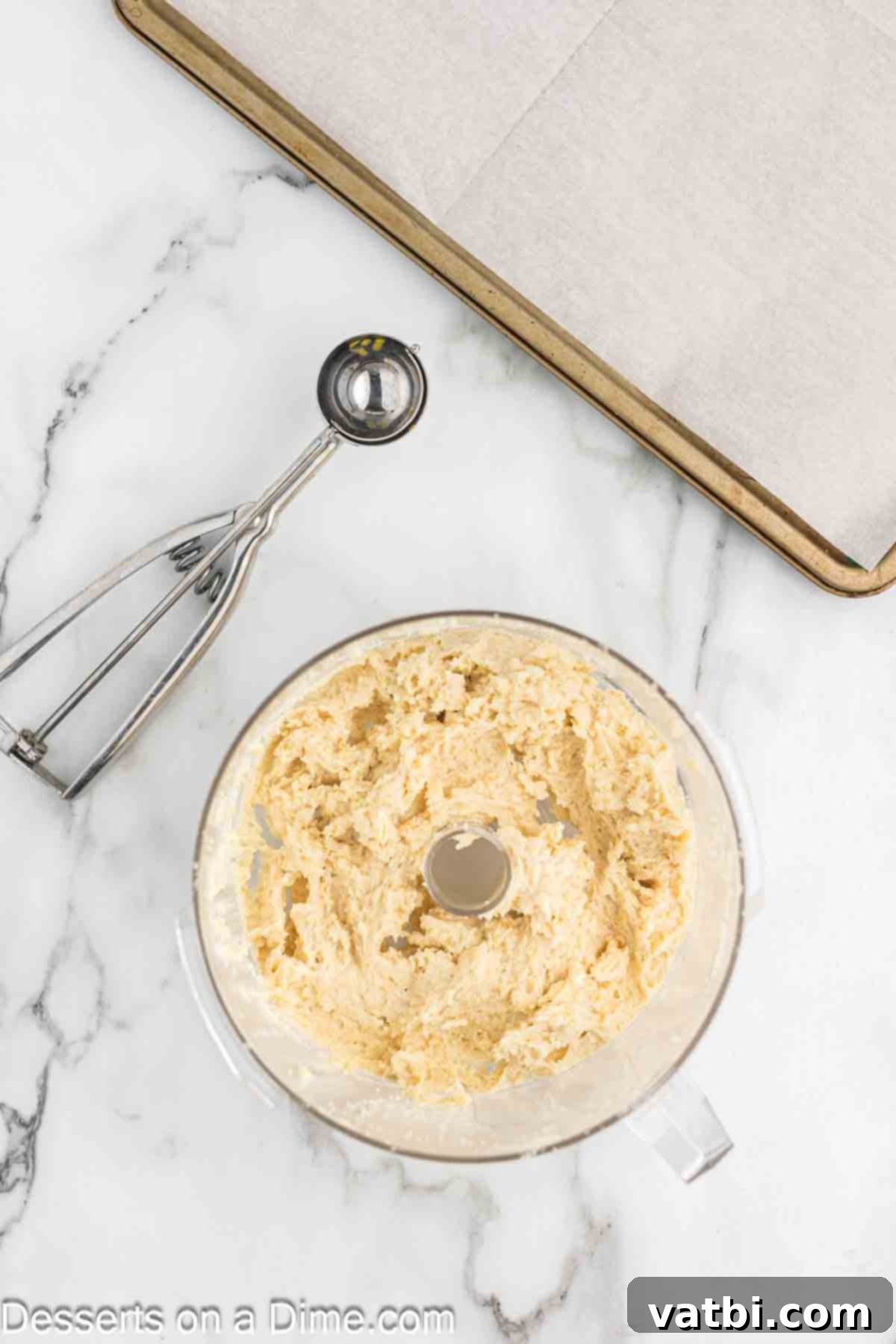 Combining the sugar cookie crumbs with cream cheese