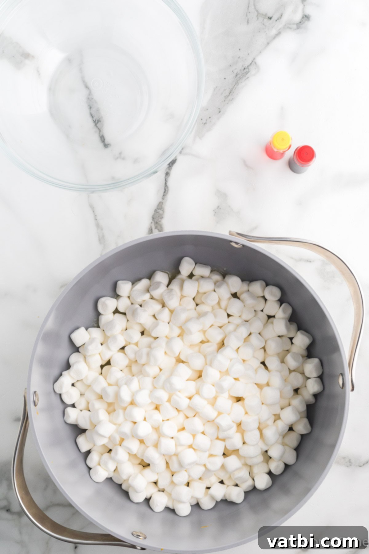 Autumn Rice Krispie Pumpkin Treats 6 Mini marshmallows in a pan.