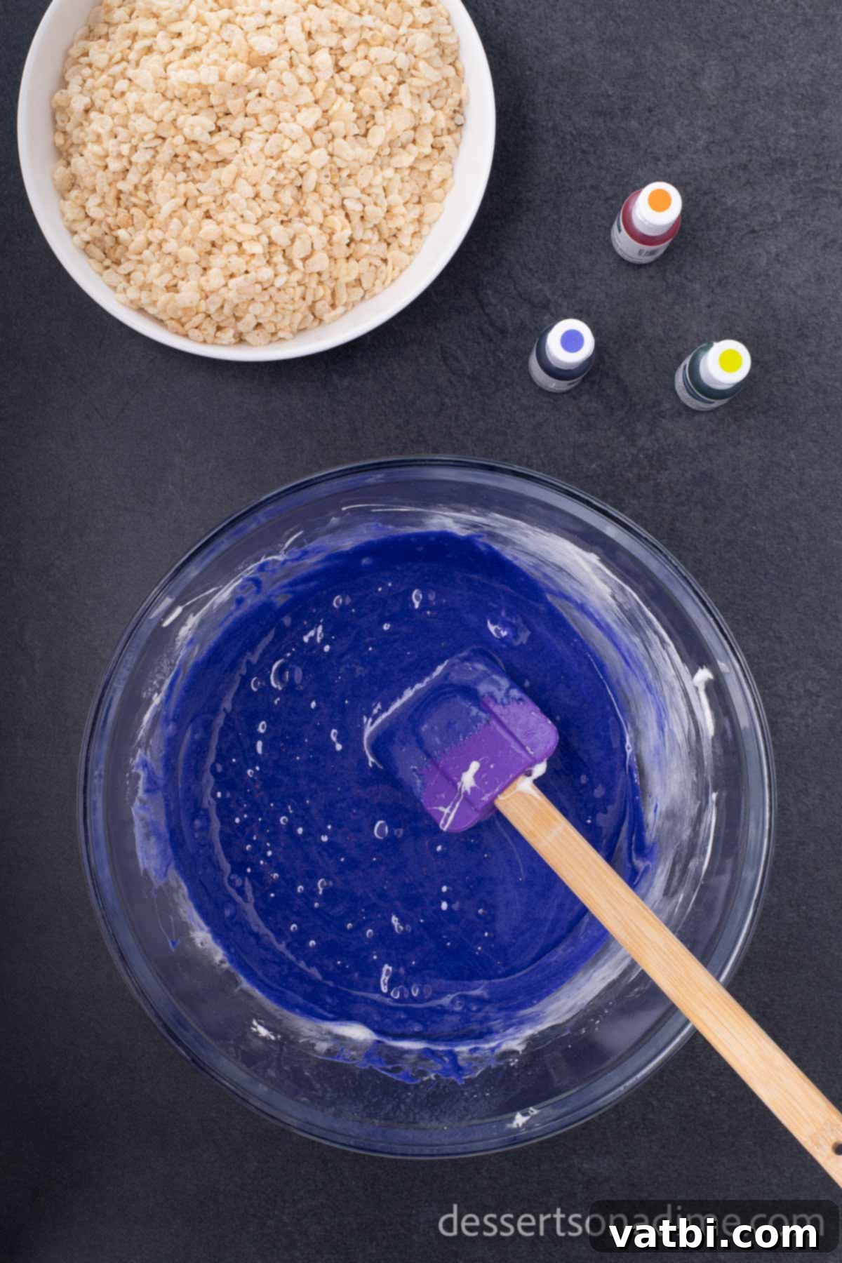 Monster Mash Krispie Treats 4 Step 3: Add green food coloring to the melted marshmallow mixture.