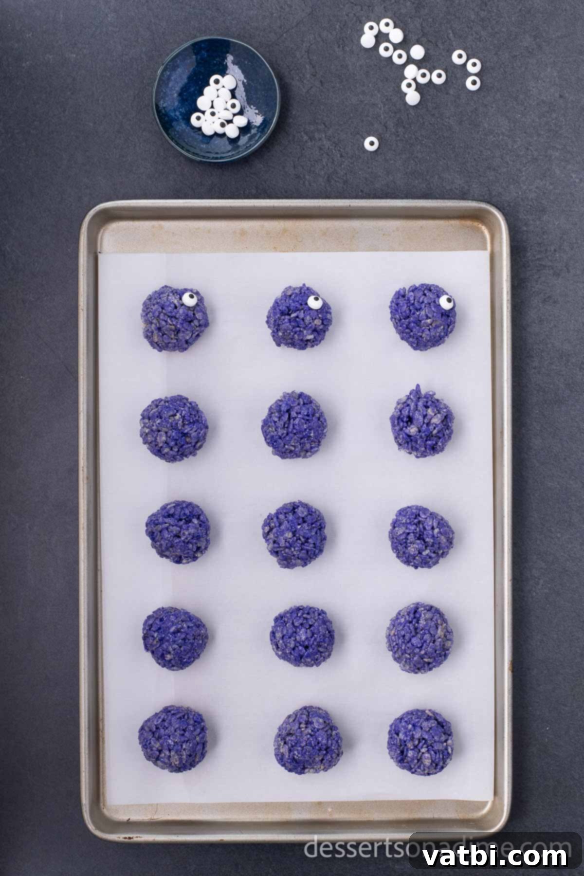 Monster Mash Krispie Treats 8 Step 7: Gently press candy eyes onto the side of the Rice Krispie balls.