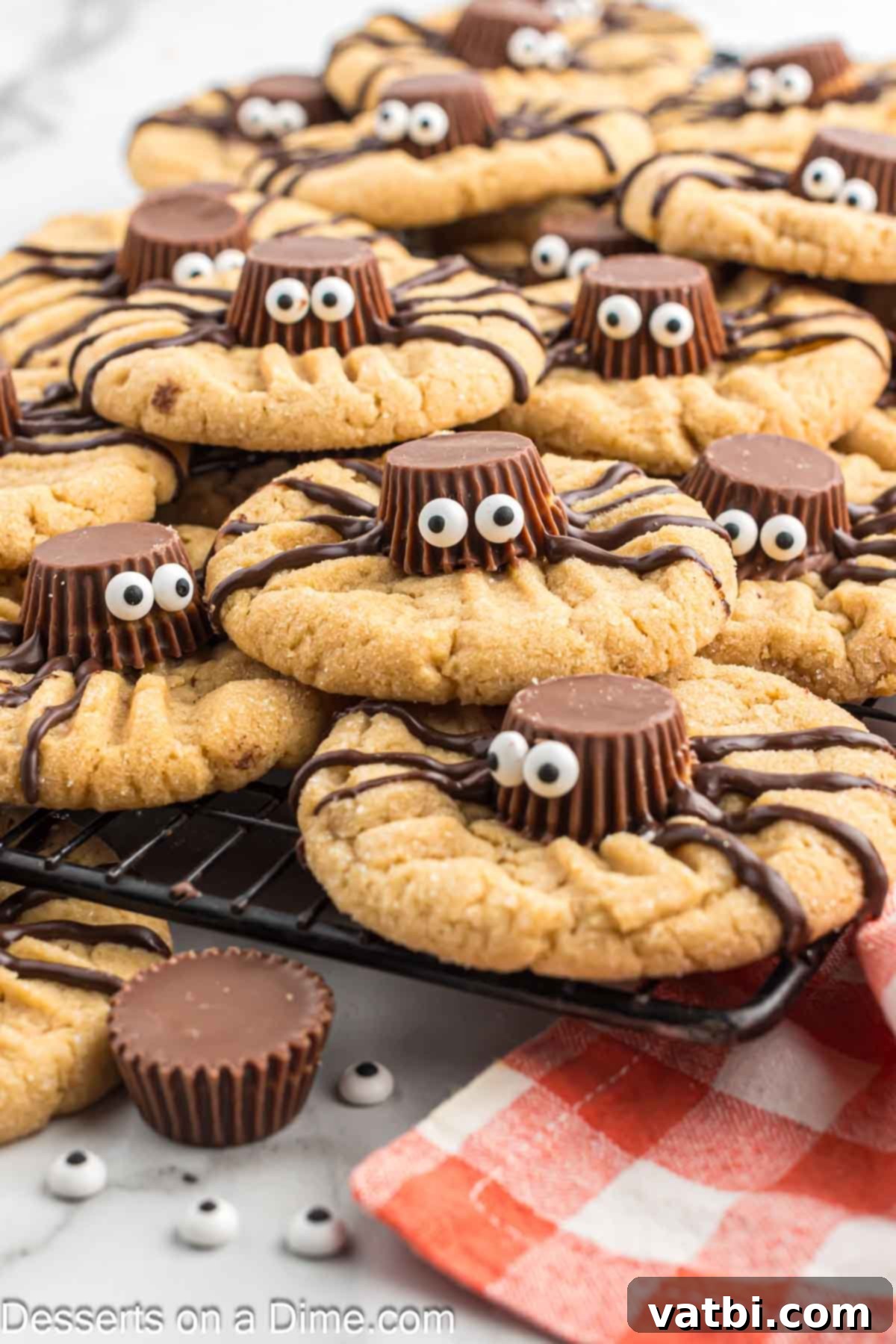 Delightfully Easy Halloween Spider Treats 2 Halloween Spider cookies stacked together ready to serve on a spooky plate.