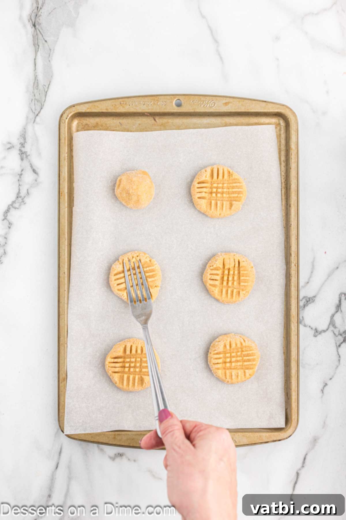Simple Spooky Halloween Spider Bites 11 Fork pressed into cookies making a criss cross design.