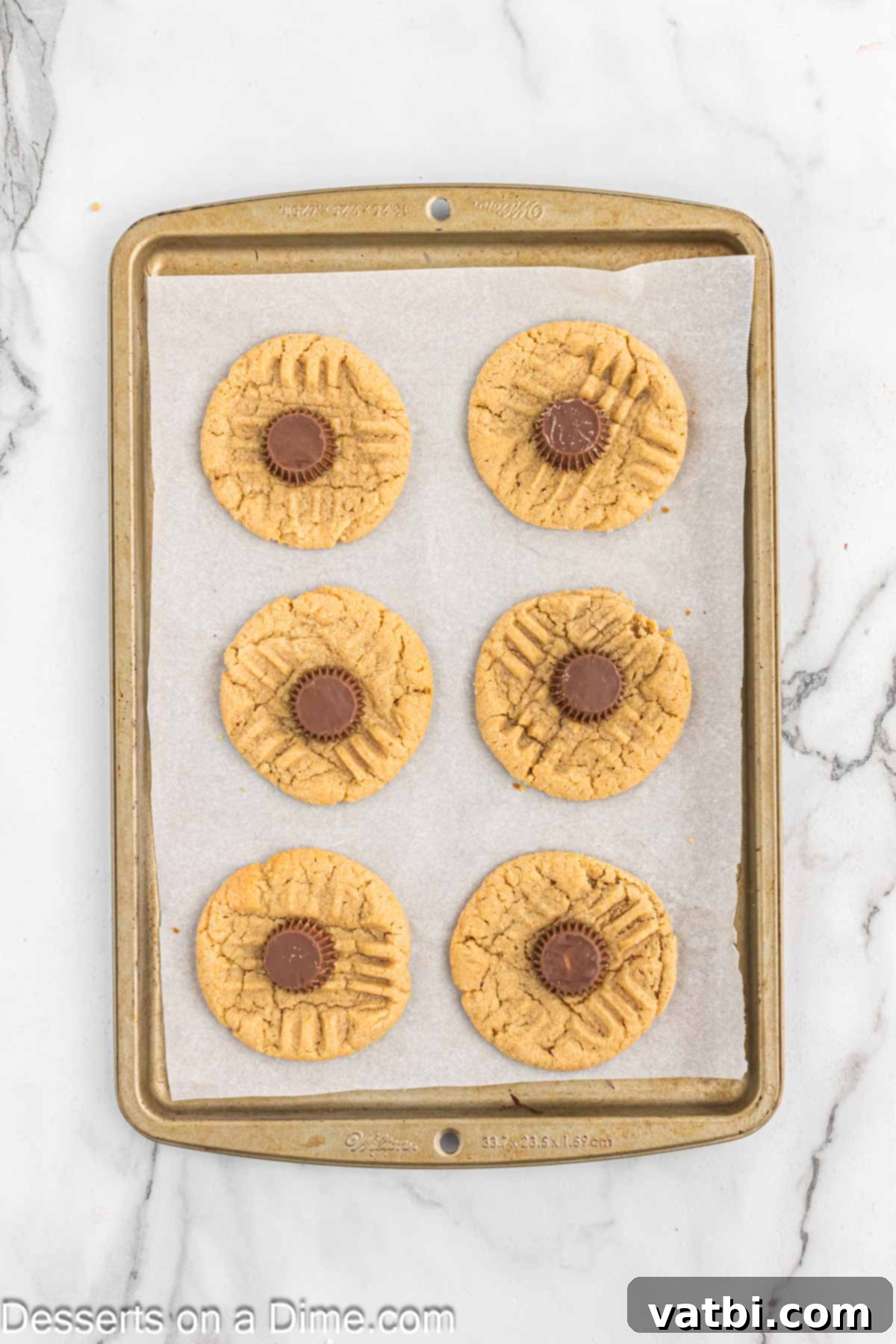 Simple Spooky Halloween Spider Bites 13 Reece's Cups added to each cookie.