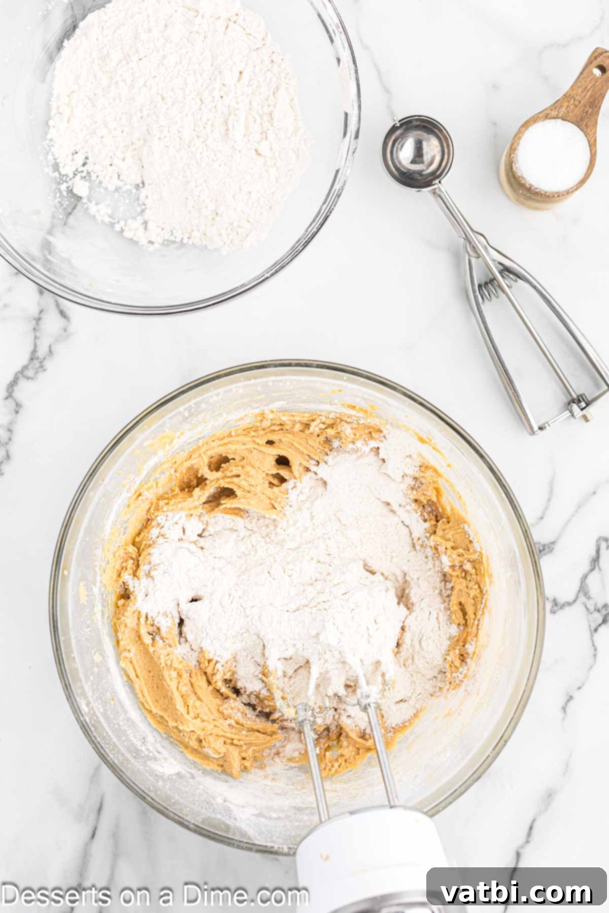 Delightfully Easy Halloween Spider Treats 8 Wet and dry ingredients combined together in a bowl for the cookie dough.