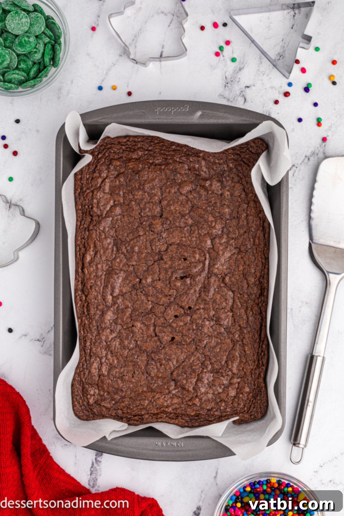 Little Debbie Inspired Christmas Tree Brownies 5 Baked brownies cooling in the pan after being removed from the oven.