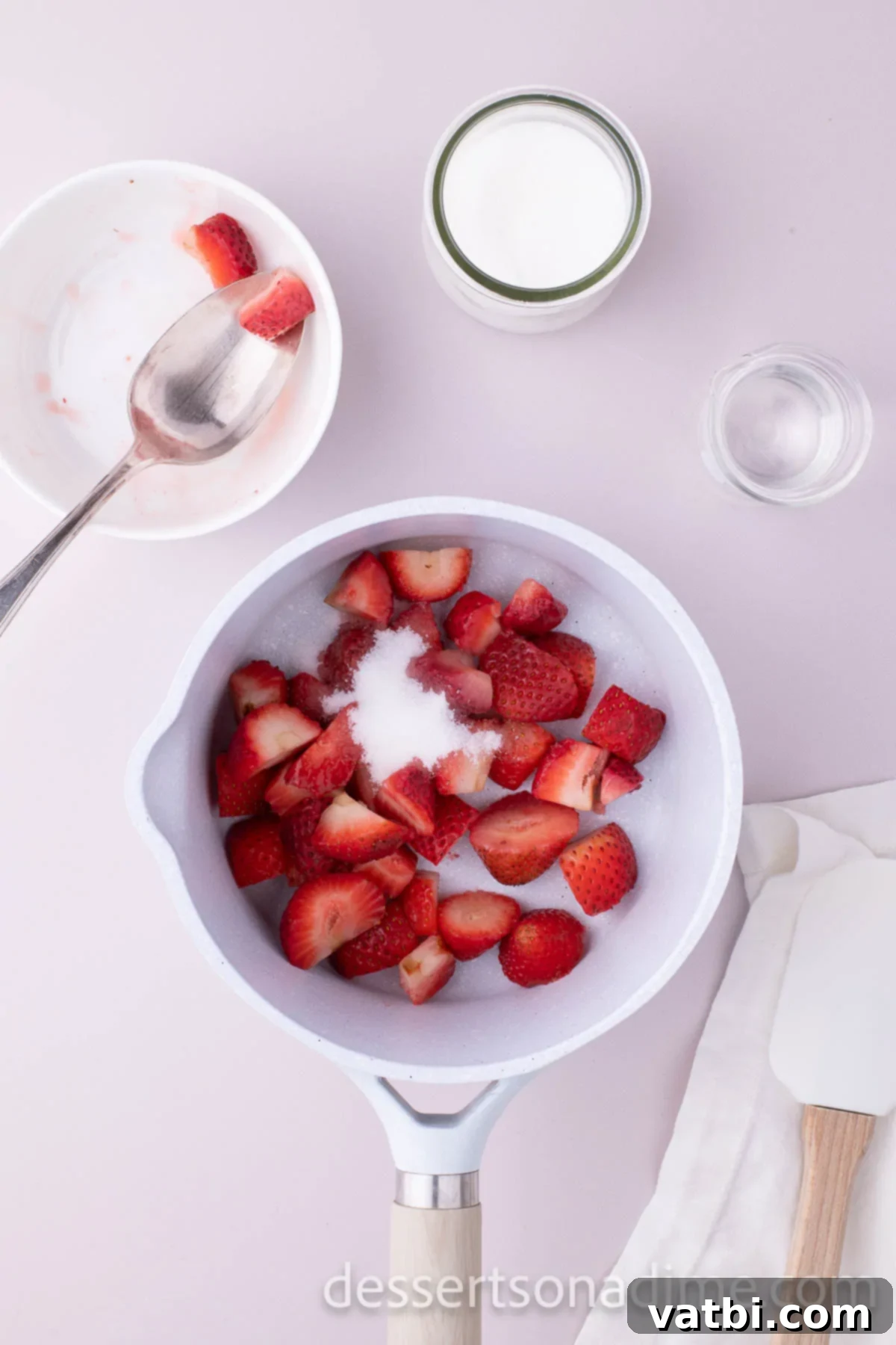 Luscious Strawberry Cream Cheese Dream 4 Strawberries and sugar in a saucepan.