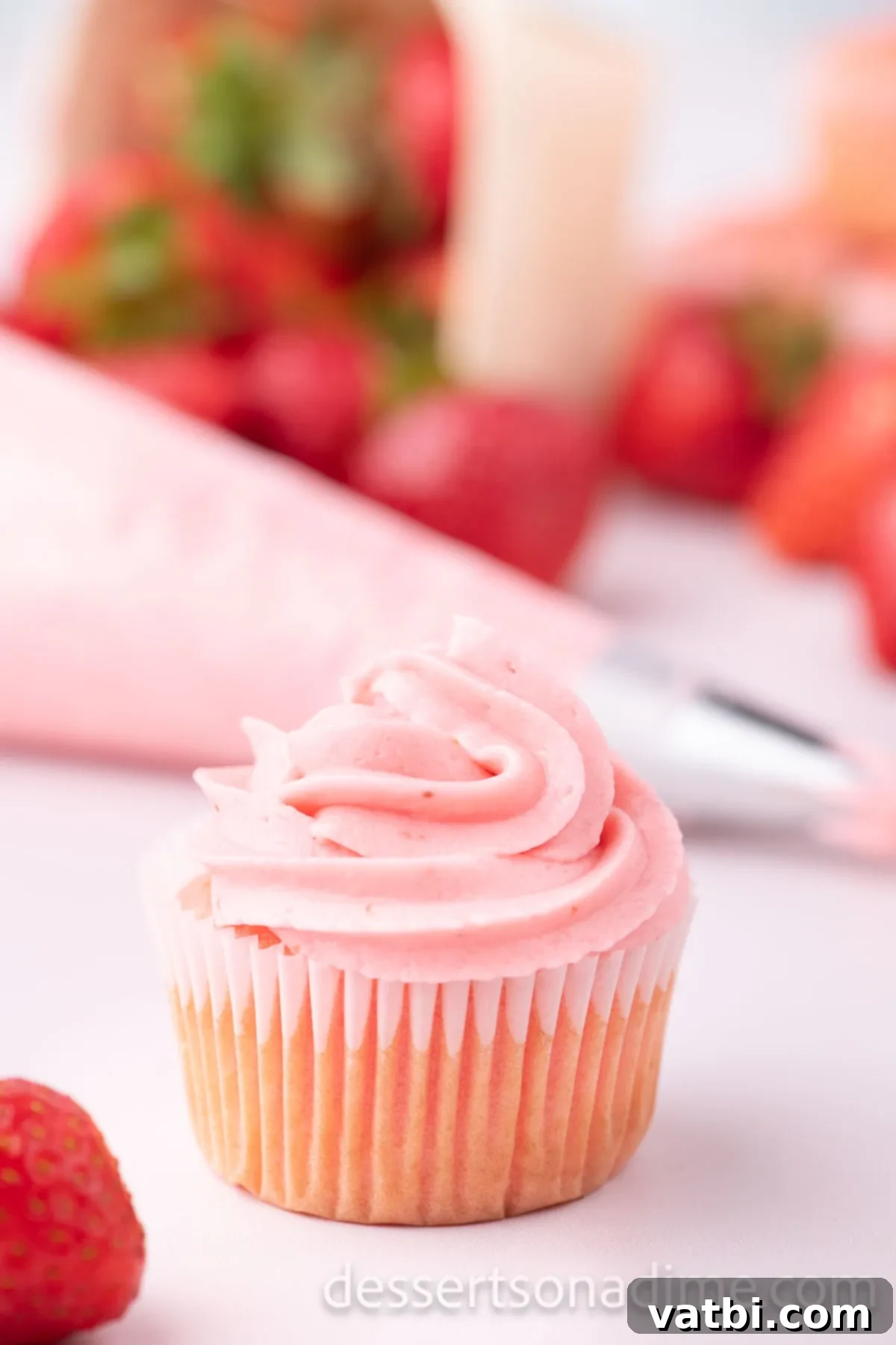 Luscious Strawberry Cream Cheese Dream 10 Strawberry Cream Cheese Frosting on a cupcake.