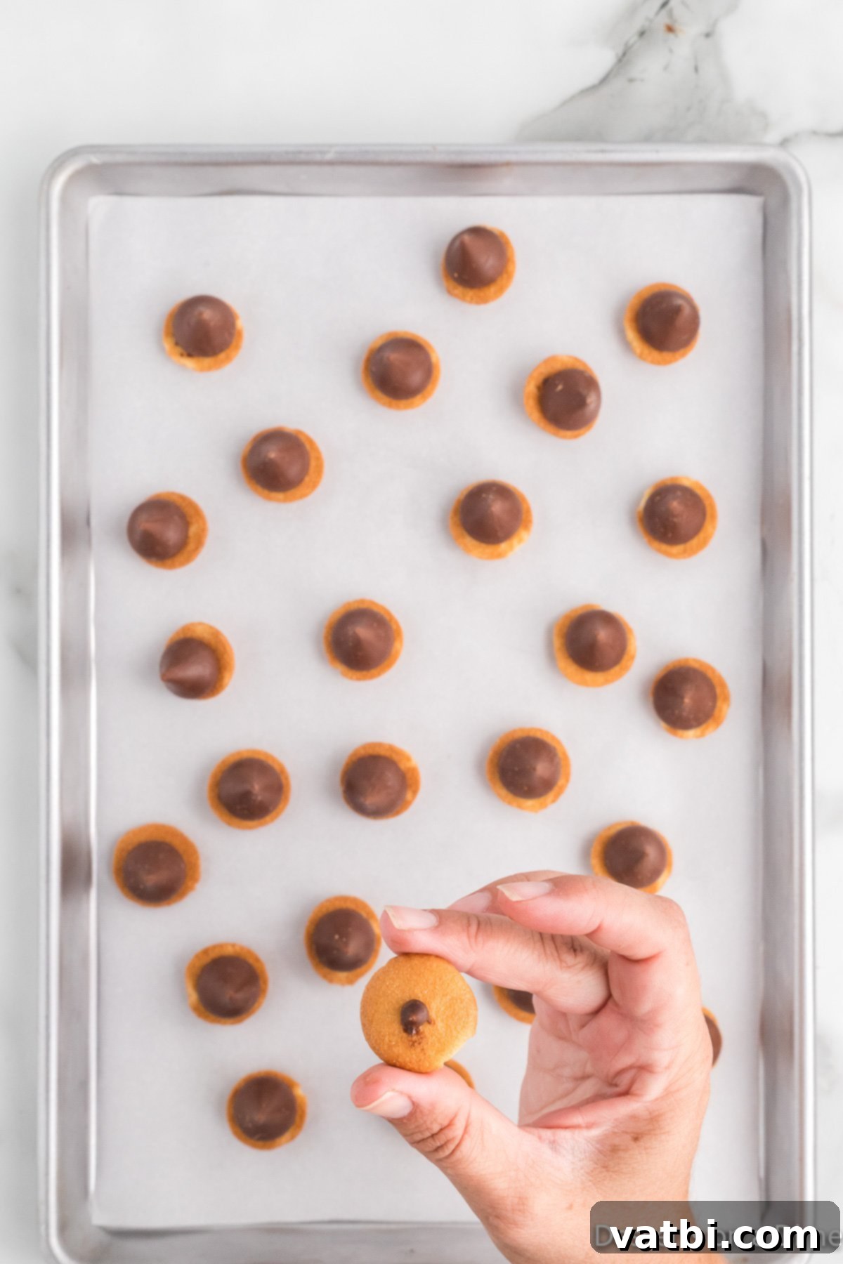 Mini chocolate chips placed on top of the cookies. 