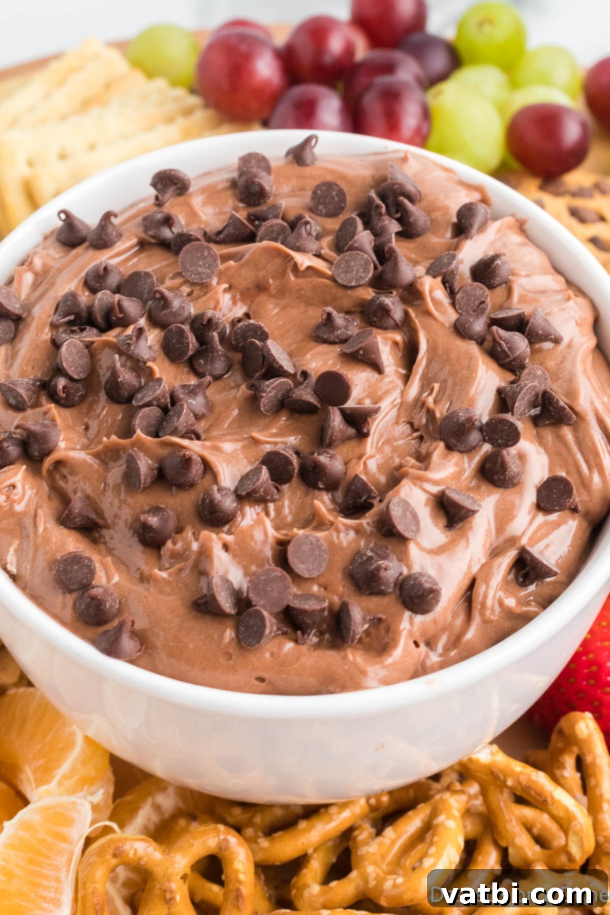 Nutella Fondue 2 Close up image of Nutella dip with fresh fruit and pretzels