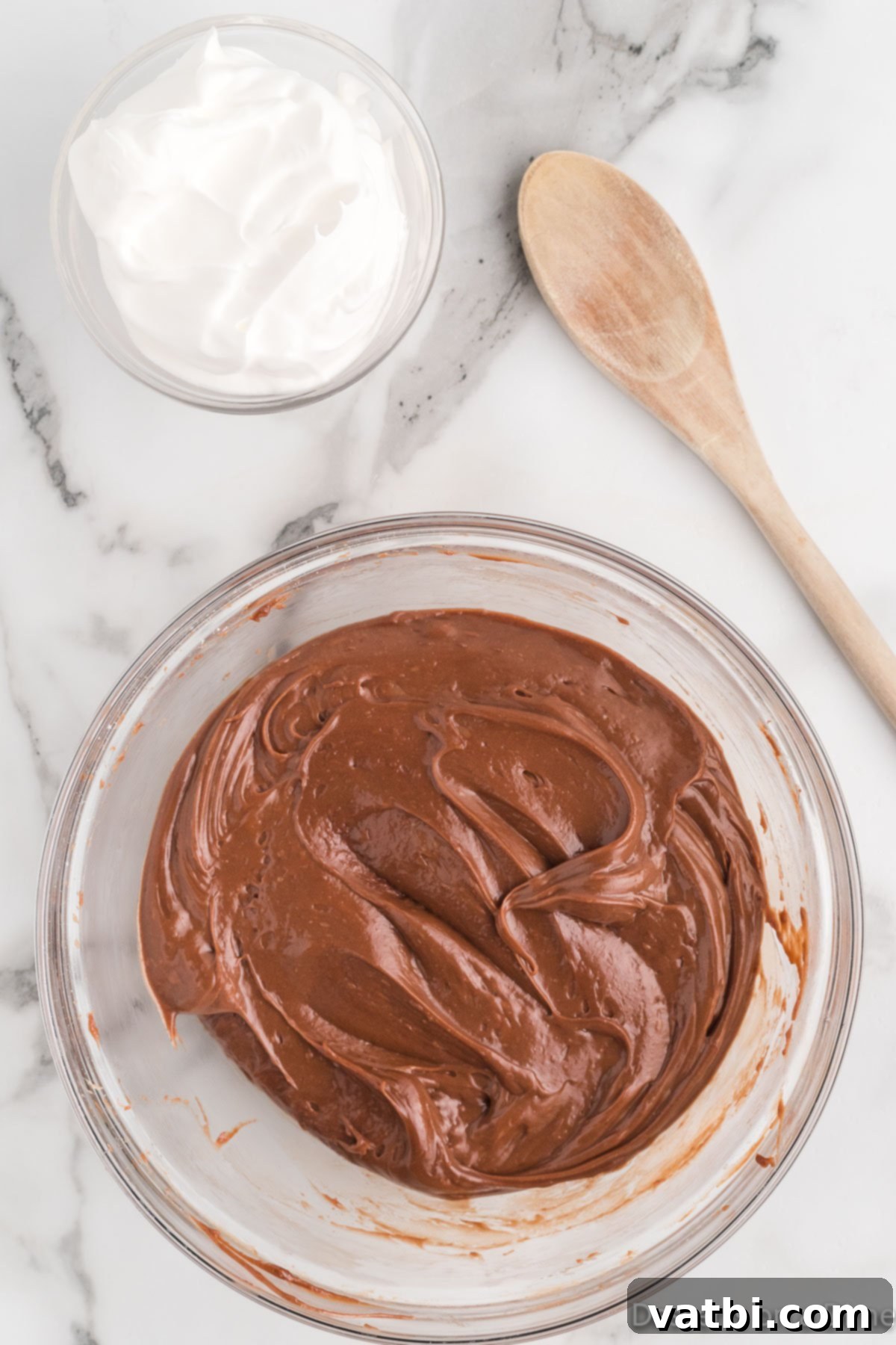 Nutella Fondue 5 Nutella added to bowl with powdered sugar.