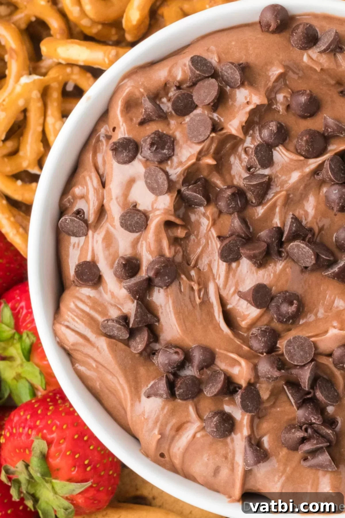 Nutella Fondue 8 Close up image of Nutella dip with fresh fruit and pretzels