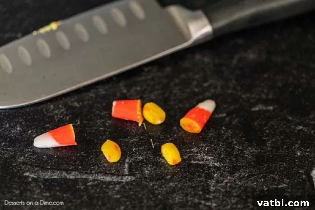 Bewitching Hat Bites 4 Yellow tips of candy corn, carefully cut and separated, ready for decoration.