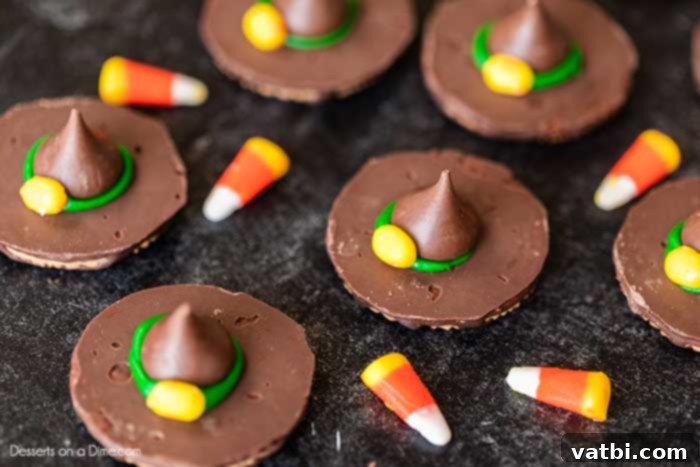 Bewitching Hat Bites 5 Finished witch hat cookies, each adorned with a yellow candy corn buckle on the green icing brim.