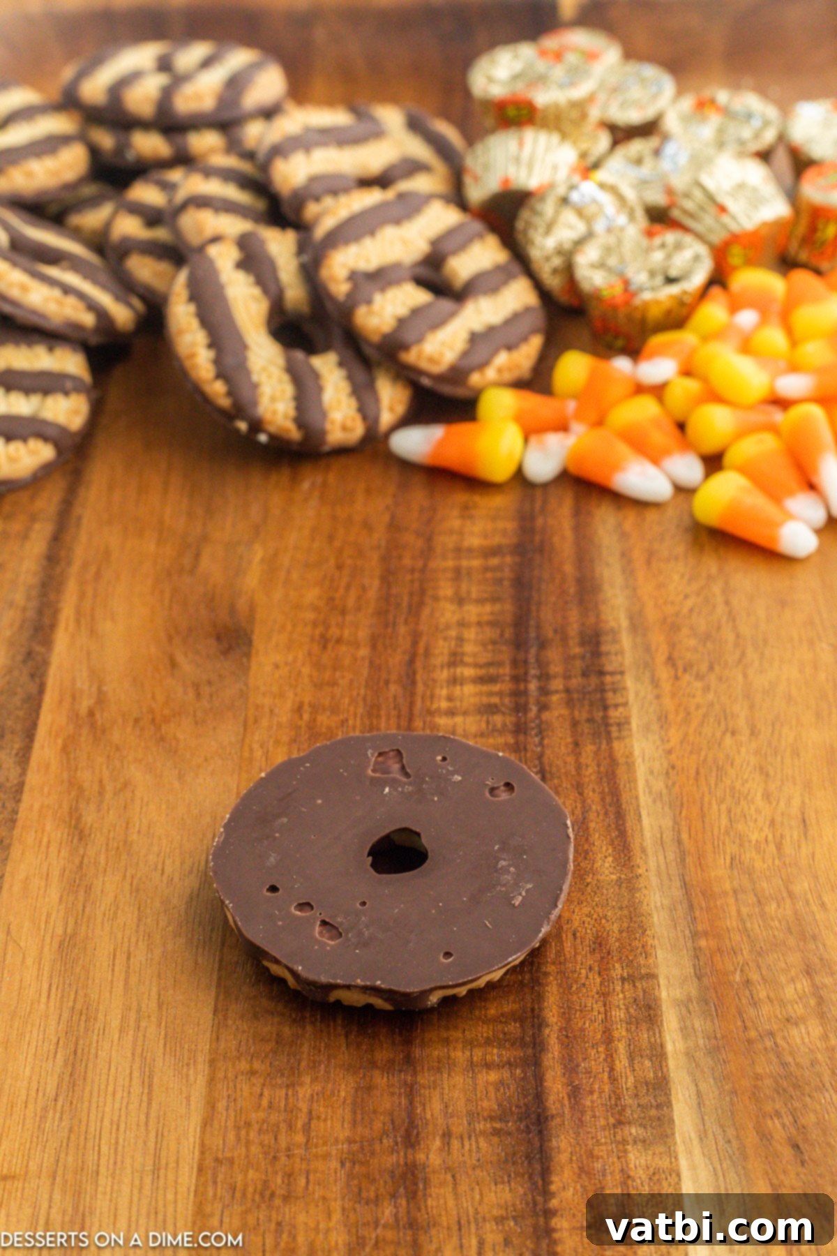 Fudge Stripe cookie placed upside down on a surface, with the chocolate side facing up, ready for decoration.