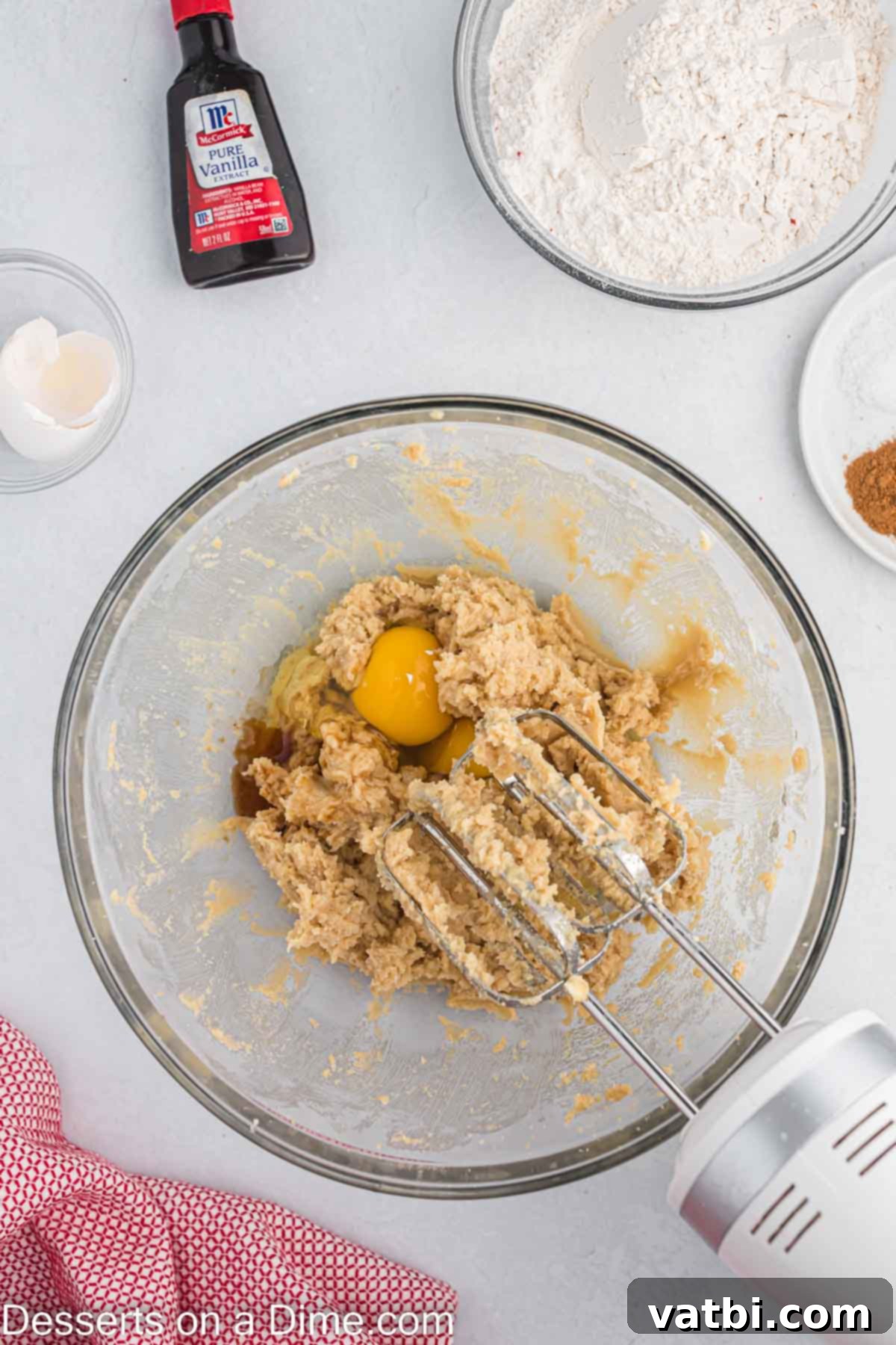 Chewy Oatmeal Raisin Cookie Perfection 3 Wet ingredients combined in a bowl, a creamy, light brown mixture ready for dry additions.