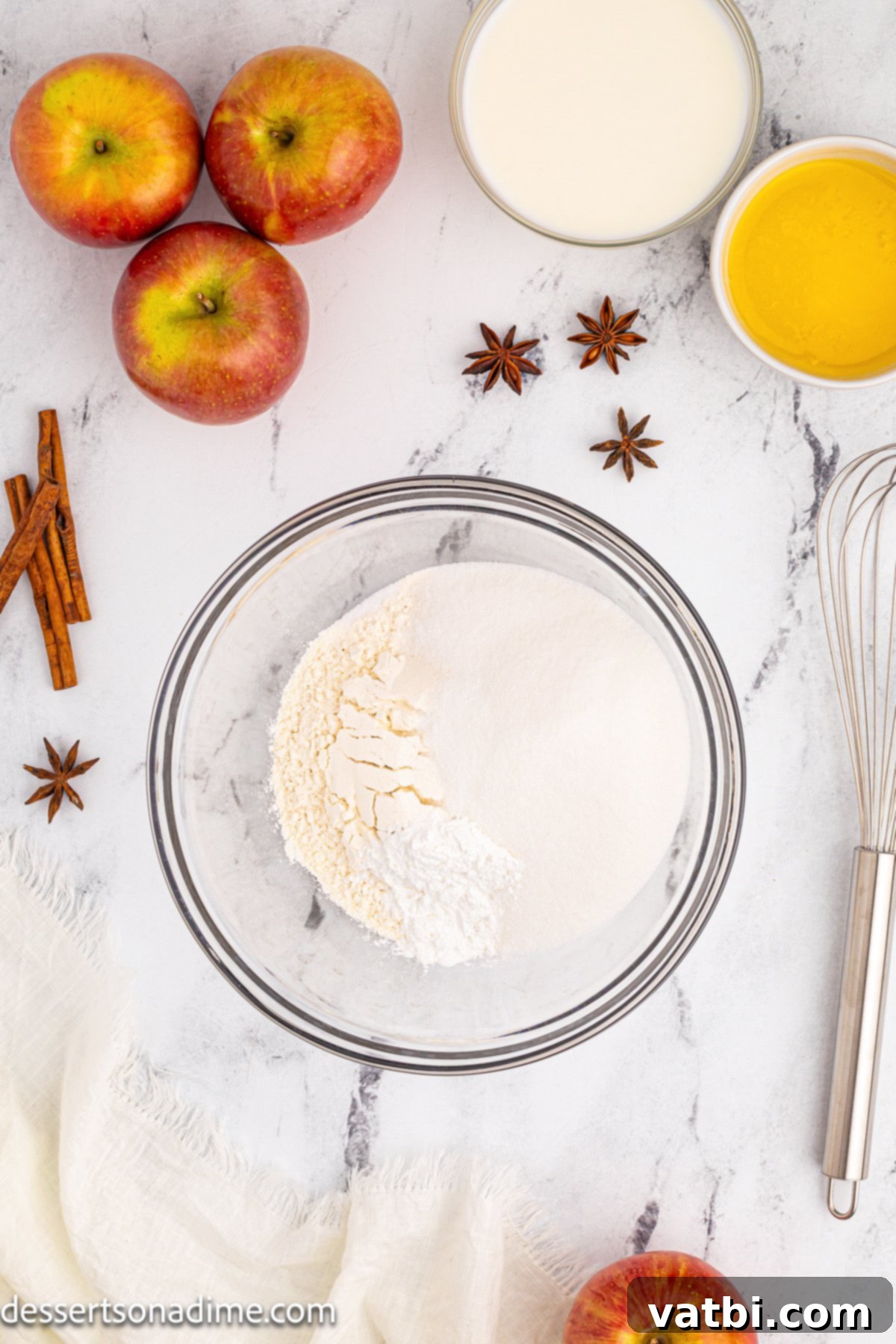 Golden Apple Cobbler Perfection 6 A mixing bowl with all-purpose flour, granulated sugar, baking powder, and salt, ready to be combined for the cobbler topping.