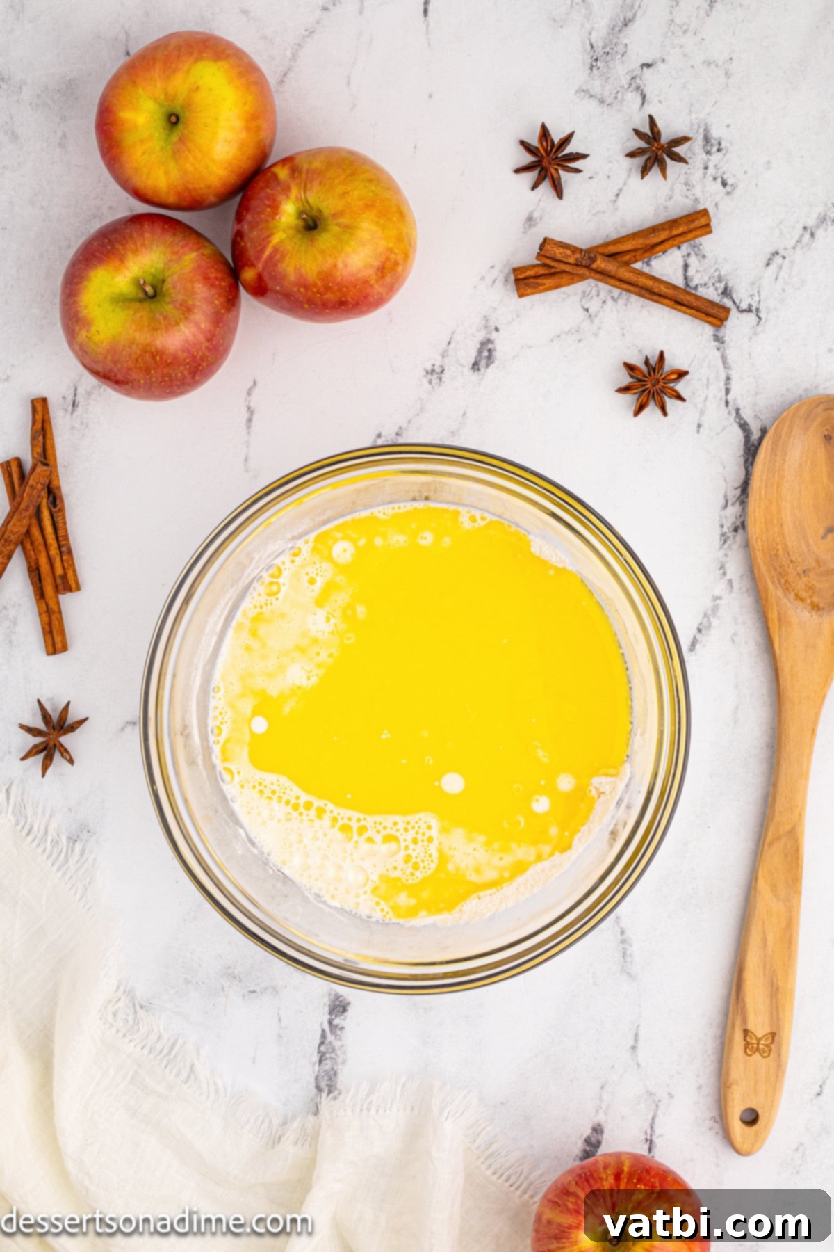 Golden Apple Cobbler Perfection 7 A bowl of freshly melted butter, a key ingredient for the rich and tender cobbler topping.