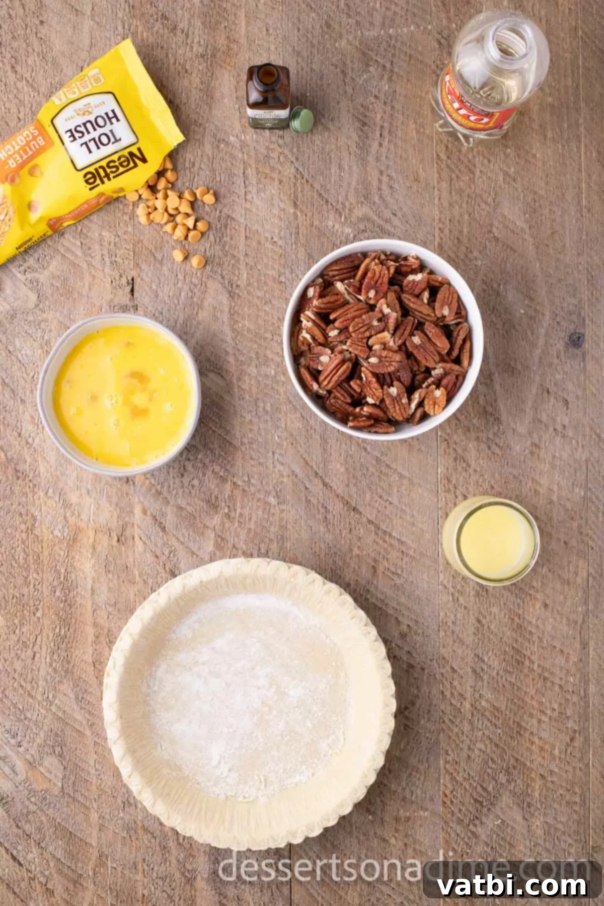 Ingredients for pie - butterscotch chips, butter, eggs, corn syrup, vanilla extract, pecan, pie crust