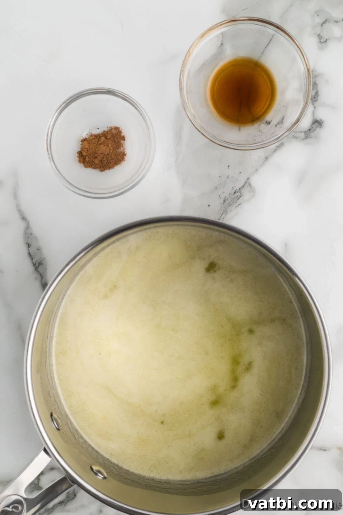 No-Bake Pumpkin Spice Treats 5 Saucepan with melted butter, sugar and milk.